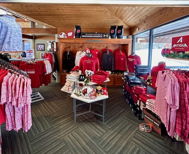 A wide shot of various racks of men's shirts